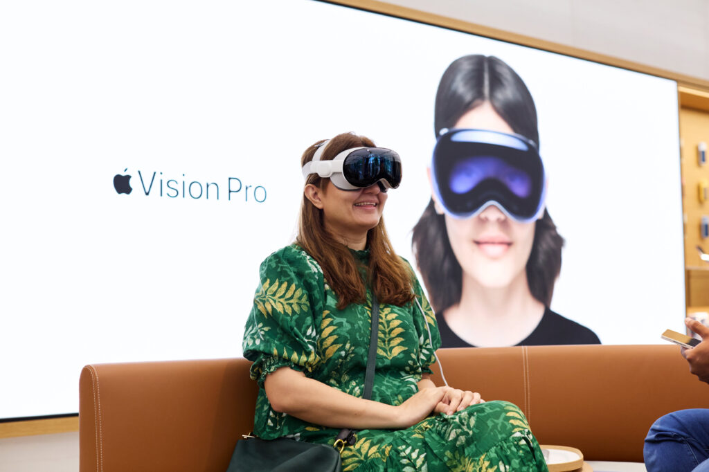 A customer takes in the powerful spatial experiences available in visionOS.